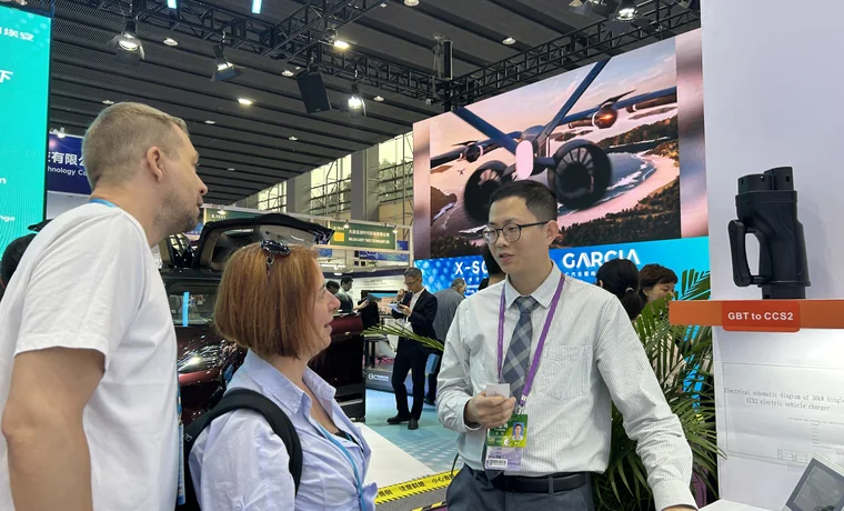 Natural Smart EV charger customer consultation at a trade exhibition